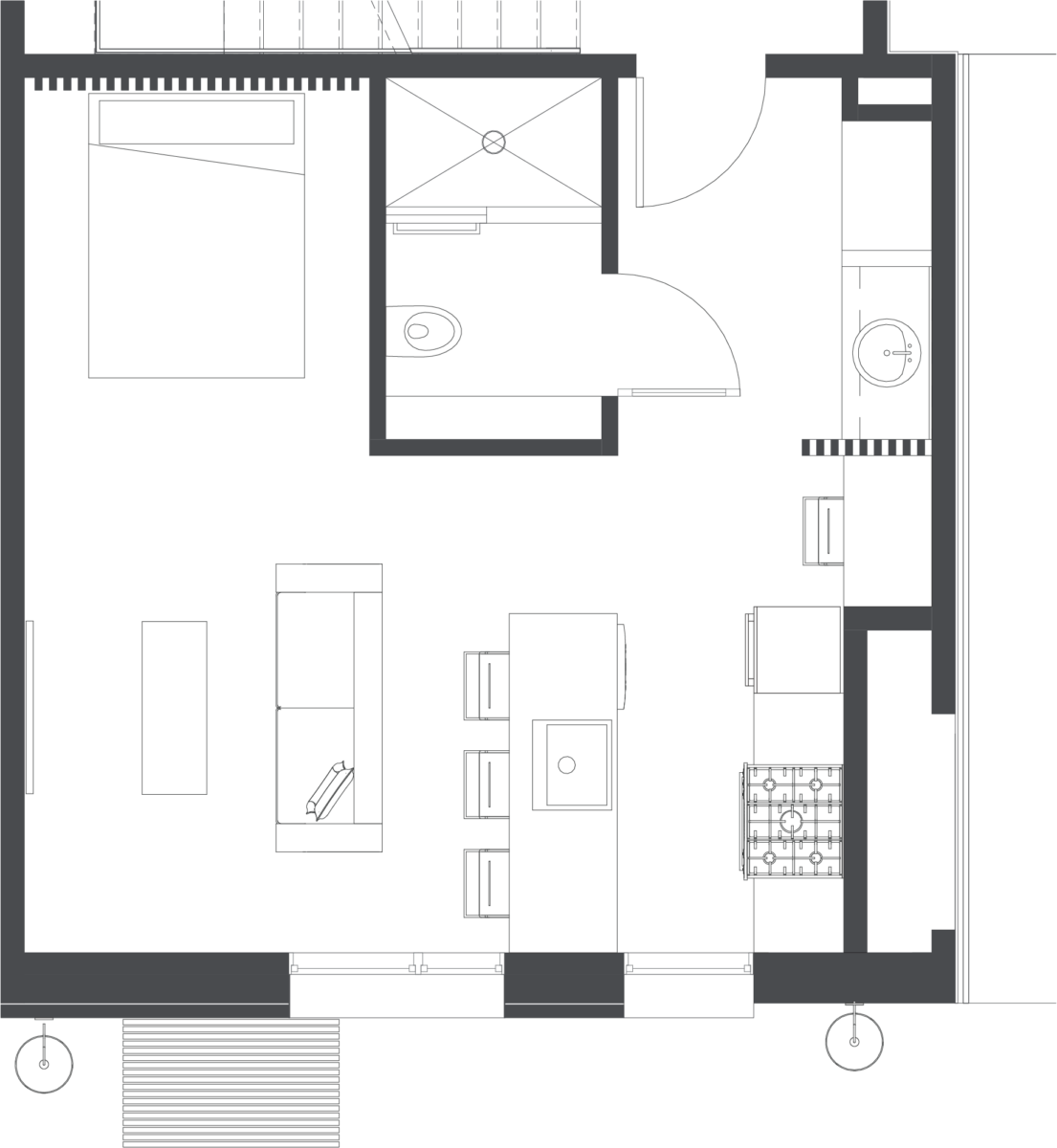 studio apartment hotel room floorplan with queen bed, couch, coffee table, desk, bathroom and eat in kitchen