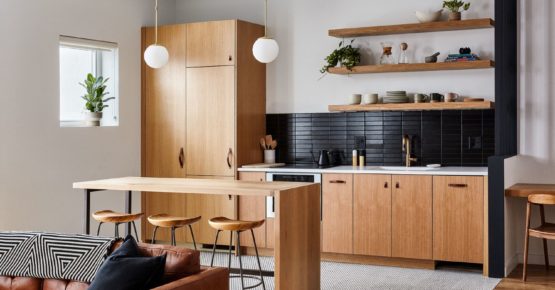 Open kitchen and dining area with refrigerator, combo oven, cooktop, sink and dishwasher