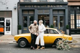 An article and photo shoot by the Venue Report on Lokal Old City including a vintage yellow Alpha Romeo out front with couple and florals