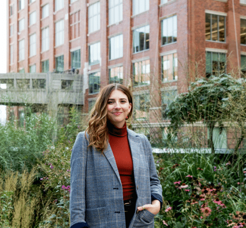 Aimee Kirby of Ferox Studio surrounded by lush landscaping on NYC Highline Park